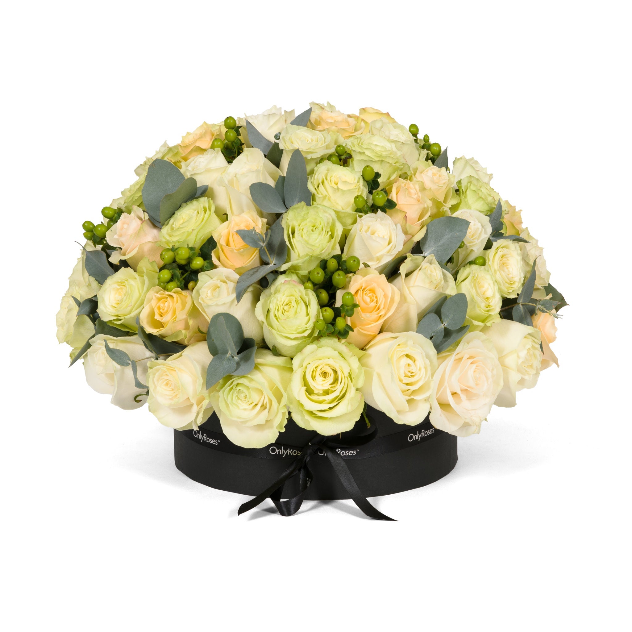 Floral arrangement in a black box with greenery on a white background