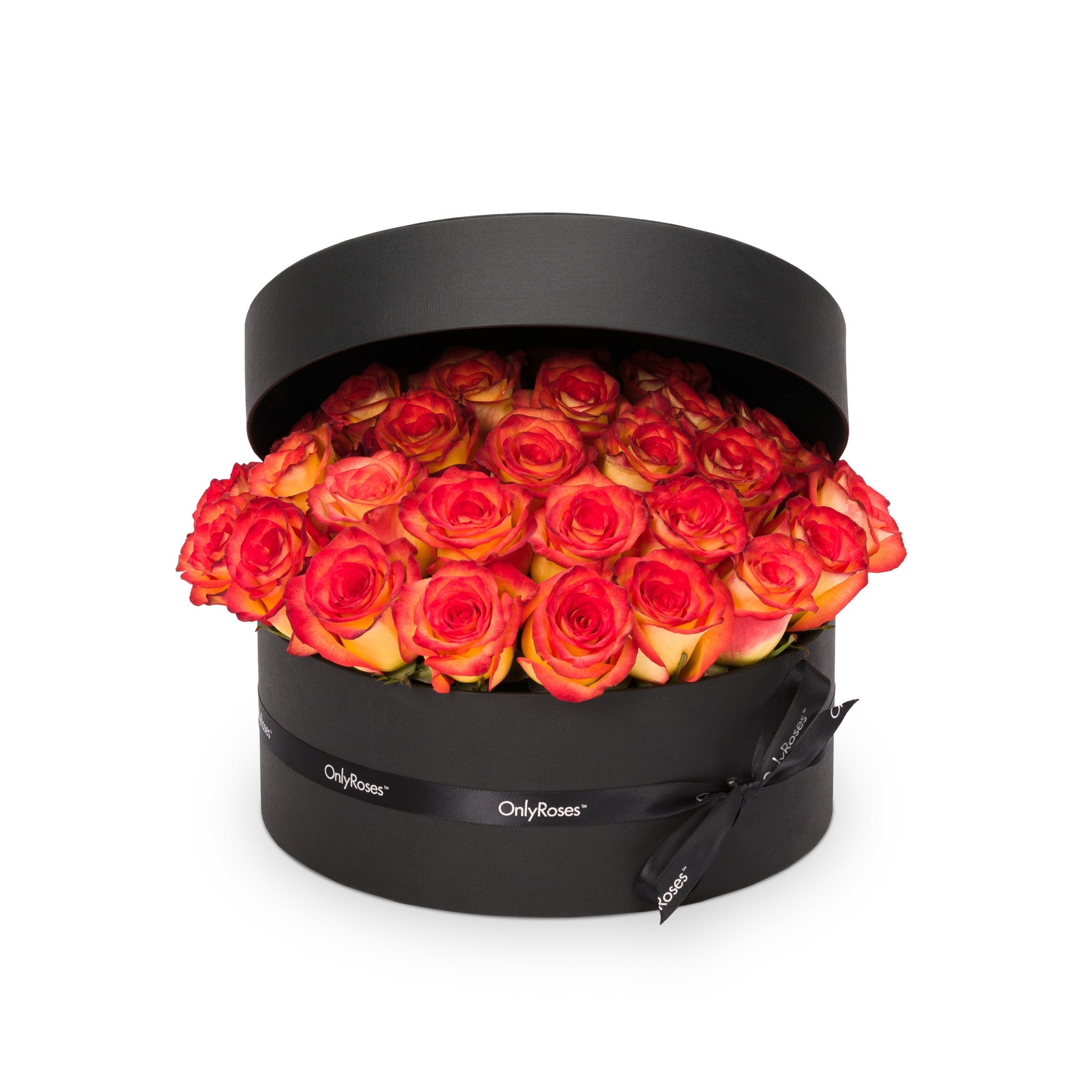Black round box filled with red and orange roses on a white background