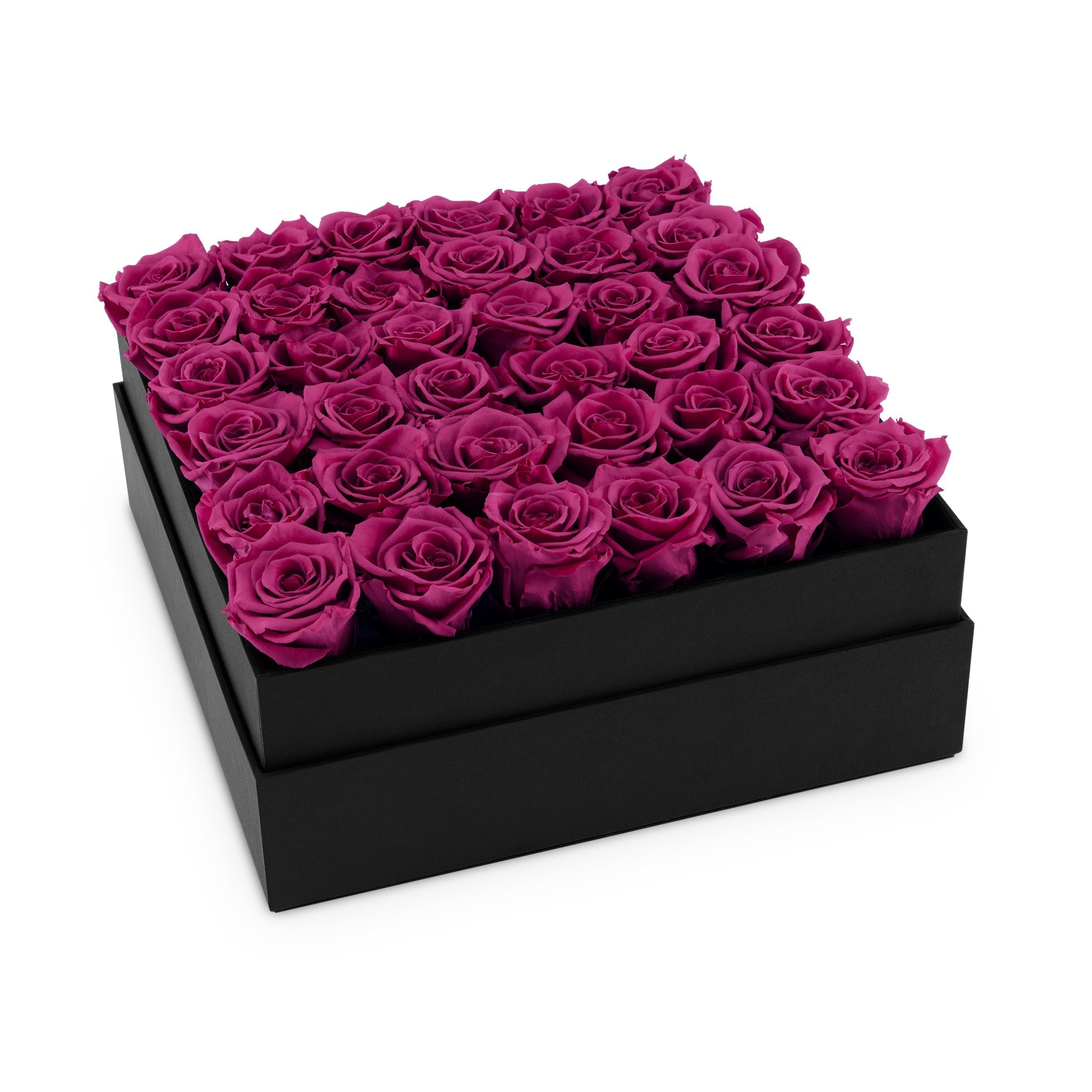 Black box filled with pink roses on a white background