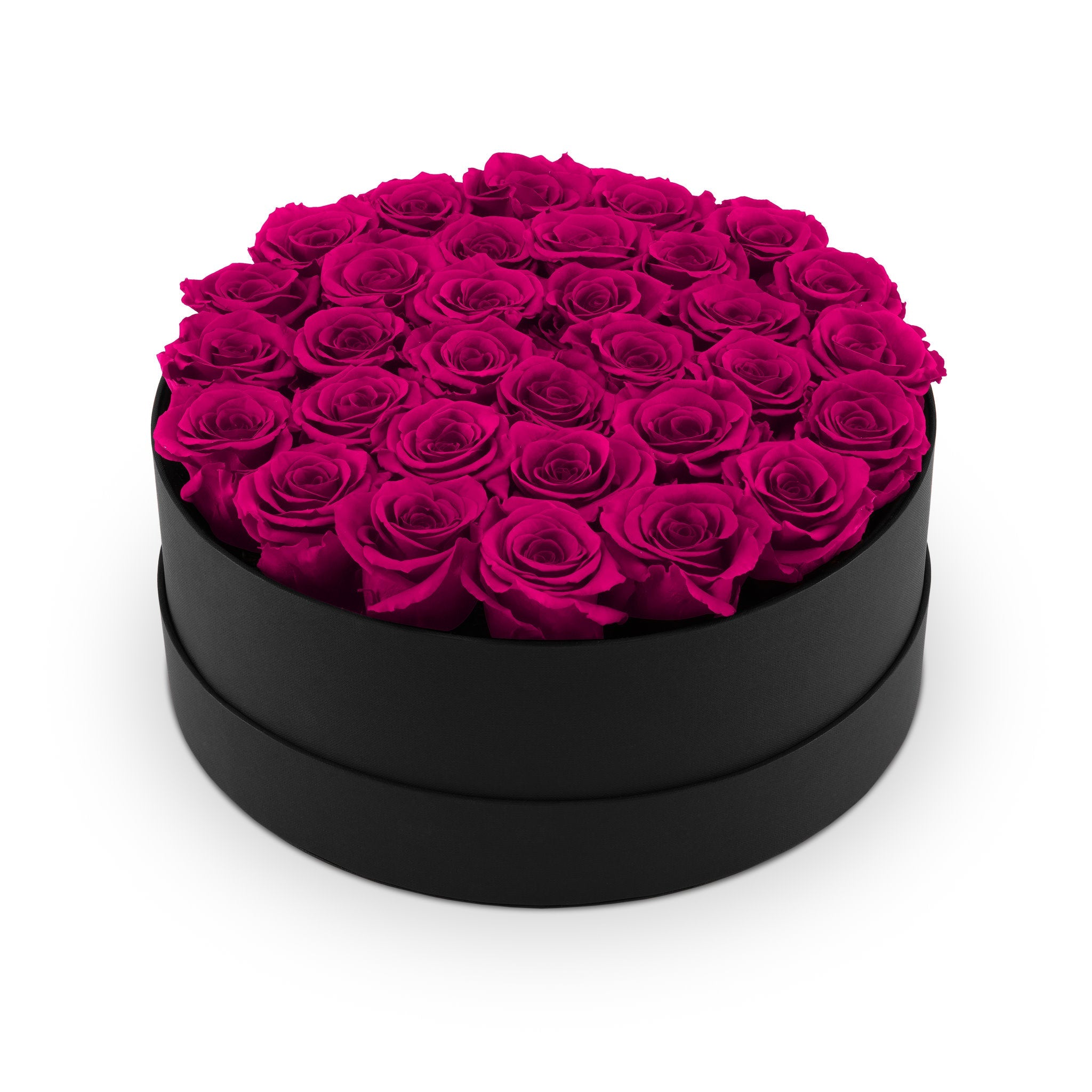 Black round box filled with pink roses on a white background