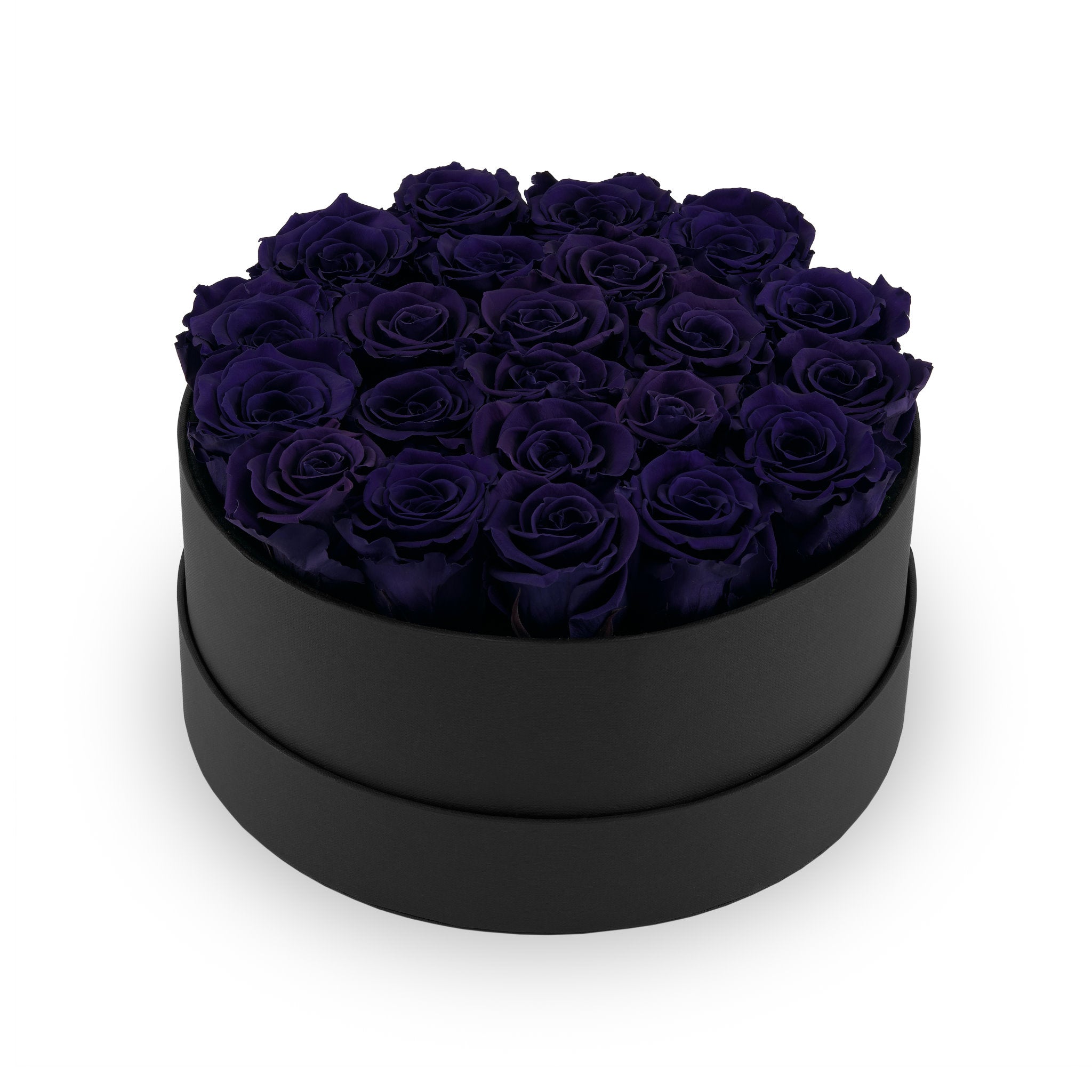 Black round box filled with dark blue roses on a white background