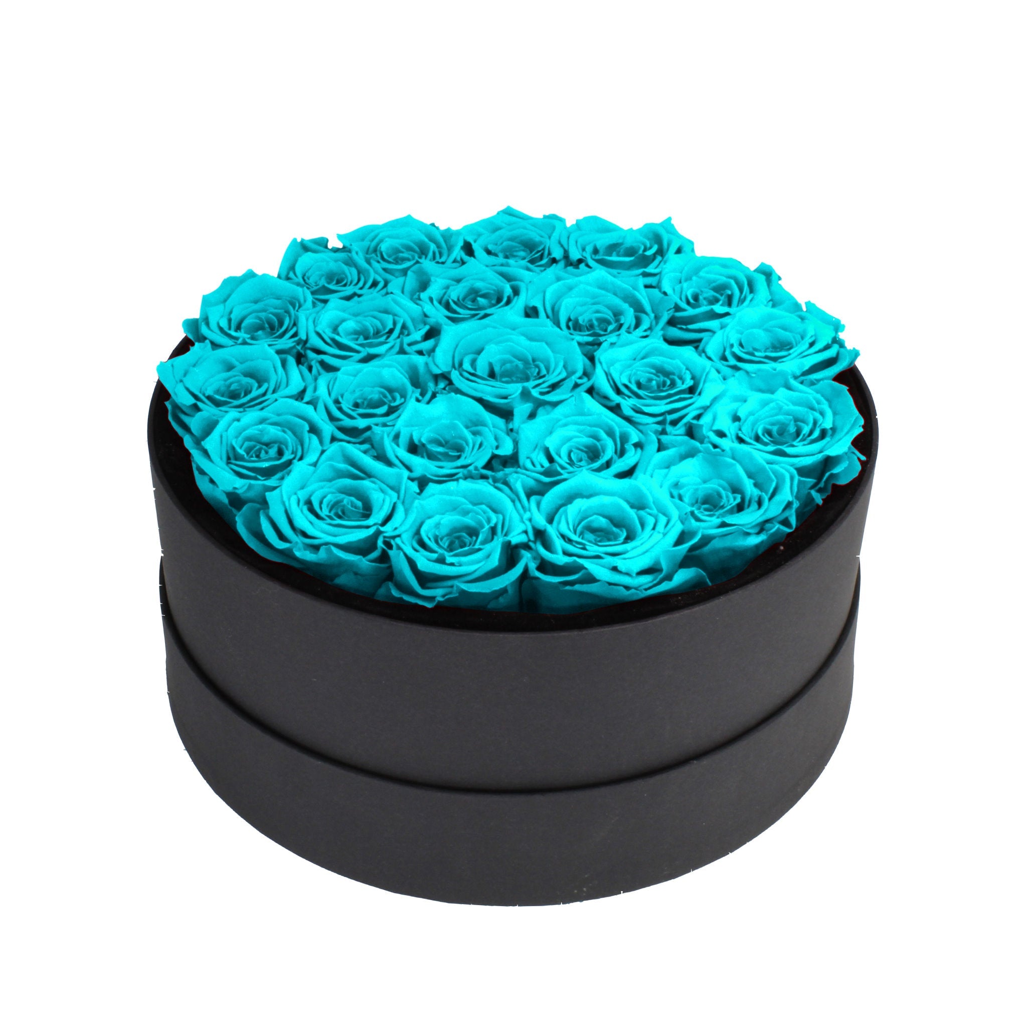 Black round box filled with turquoise roses on a white background