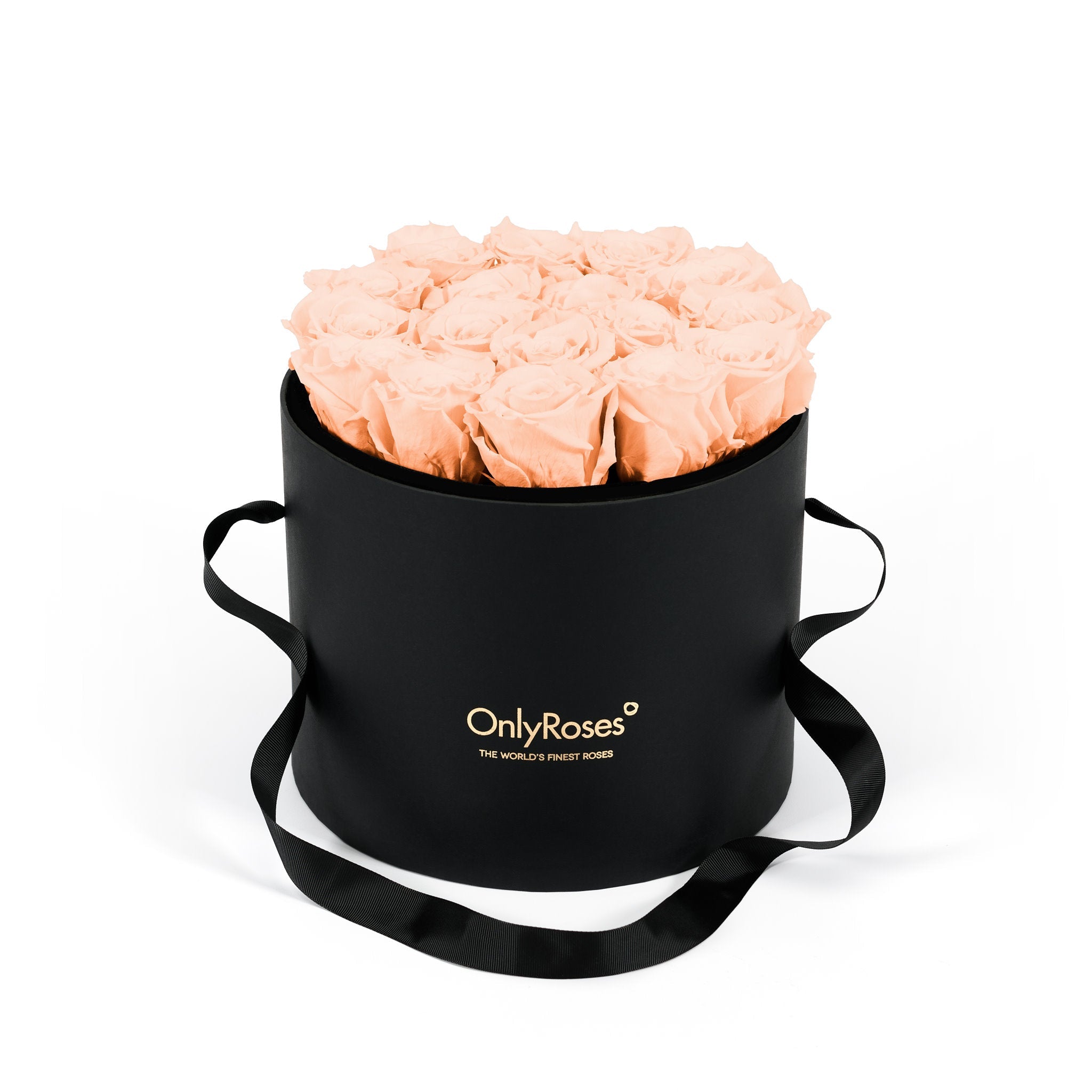Black round flower box with peach roses and 'Only Roses' branding on a white background
