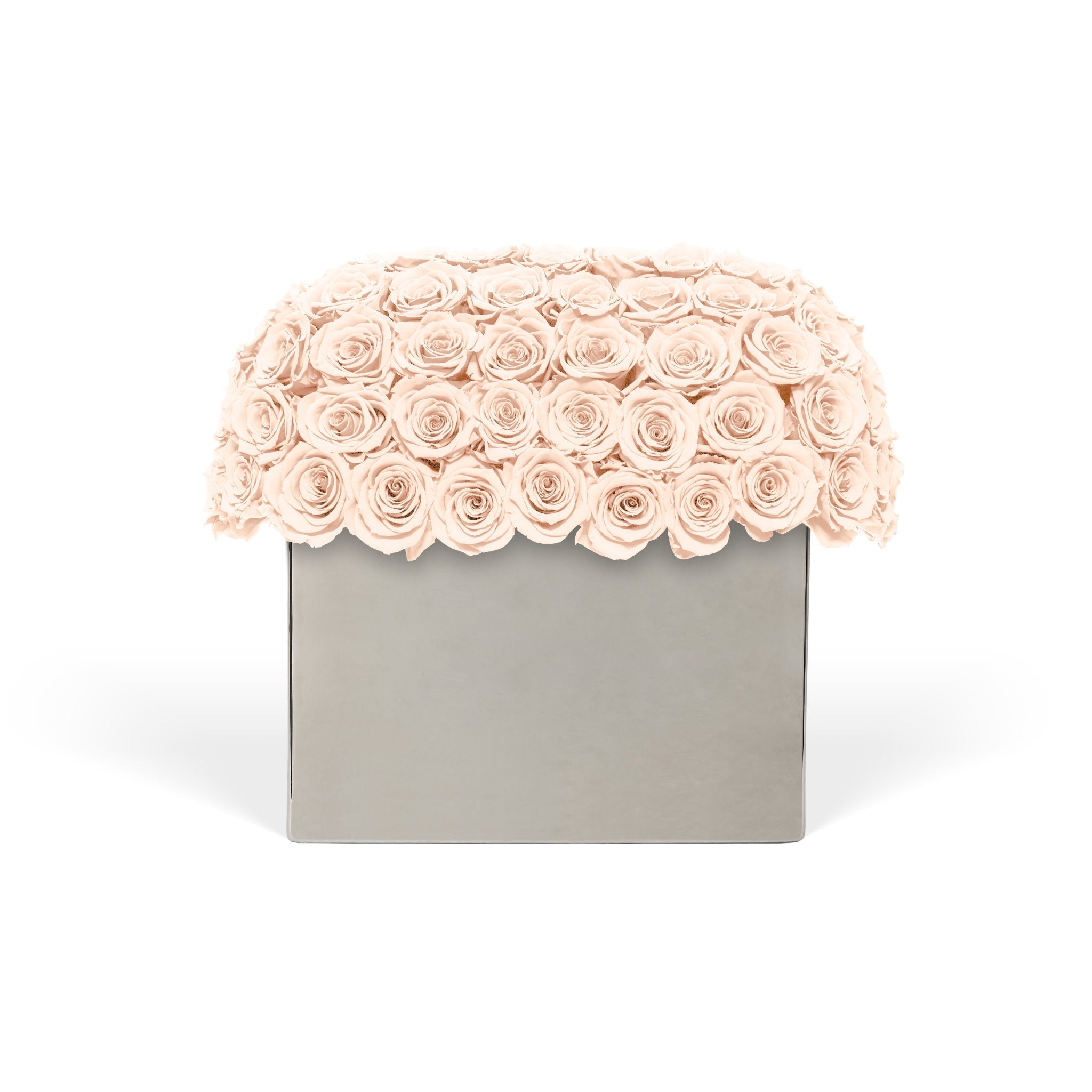 Floral arrangement with pink roses on a gray box against a white background