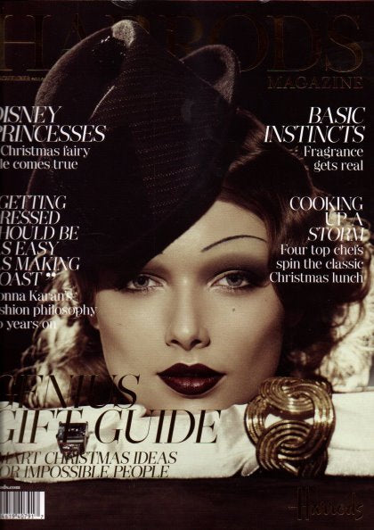 Cover of Disney's Magazine featuring a close-up portrait of a woman in a black hat and dark makeup, with visible cover text including 'Disney Princesses' and 'Gift Guide'.