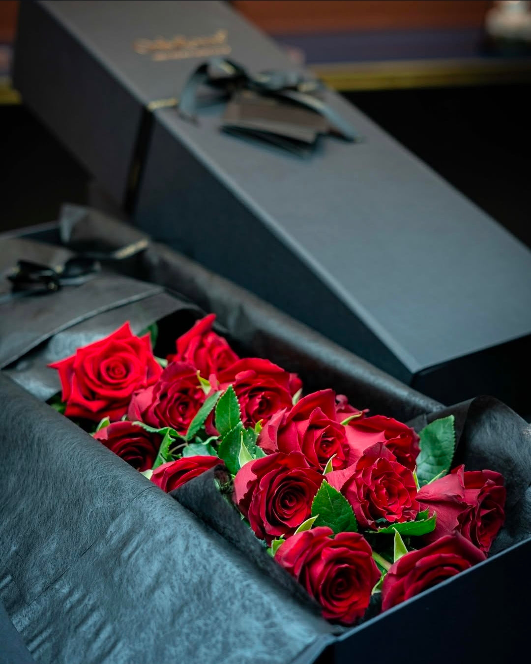Black Gesture gift box branded OnlyRoses with red roses