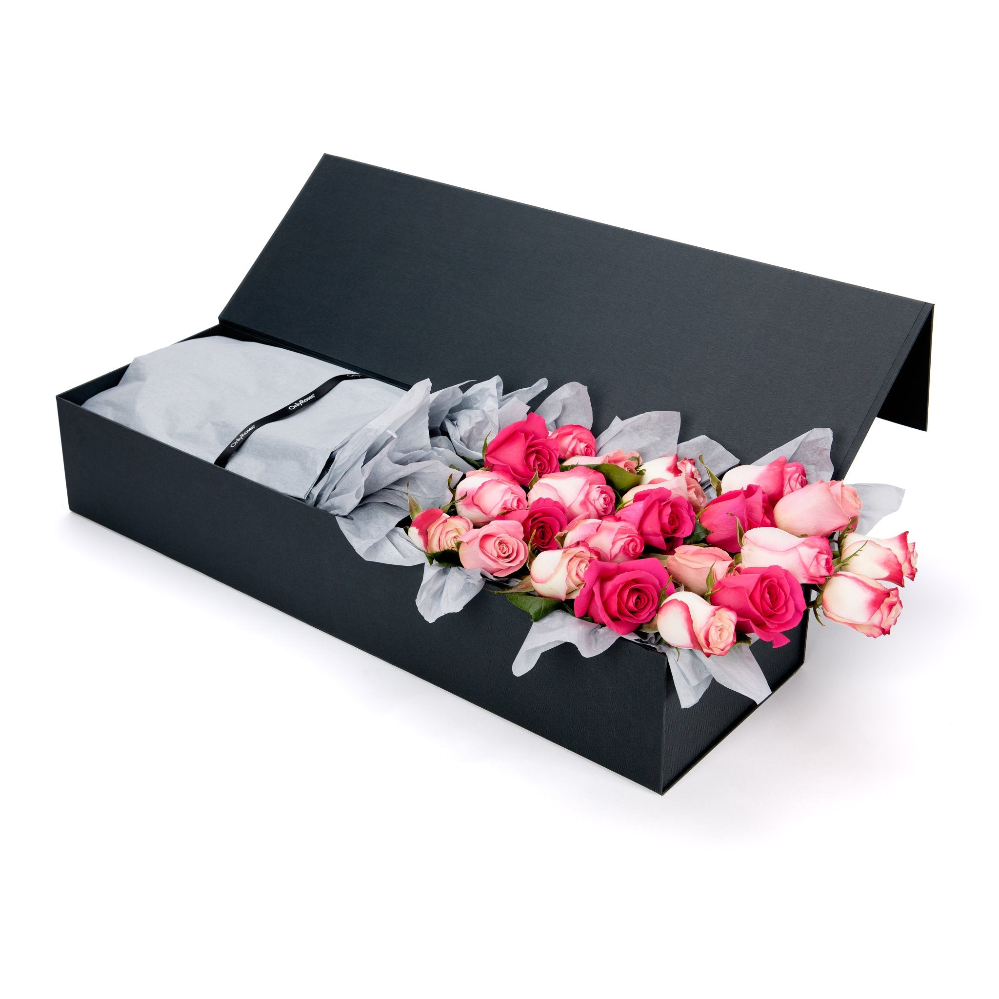 Black box with pink and white roses on a white background
