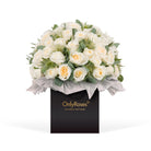 Bouquet of white roses in a box with 'Only Roses' branding on a white background