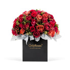 Bouquet of red and orange roses in a black 'Only Roses' bag on a white background
