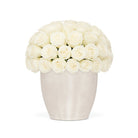 White vase filled with white roses on a white background