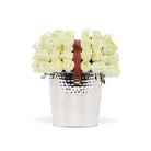 Silver bucket with white flowers and a brown leather strap on a white background