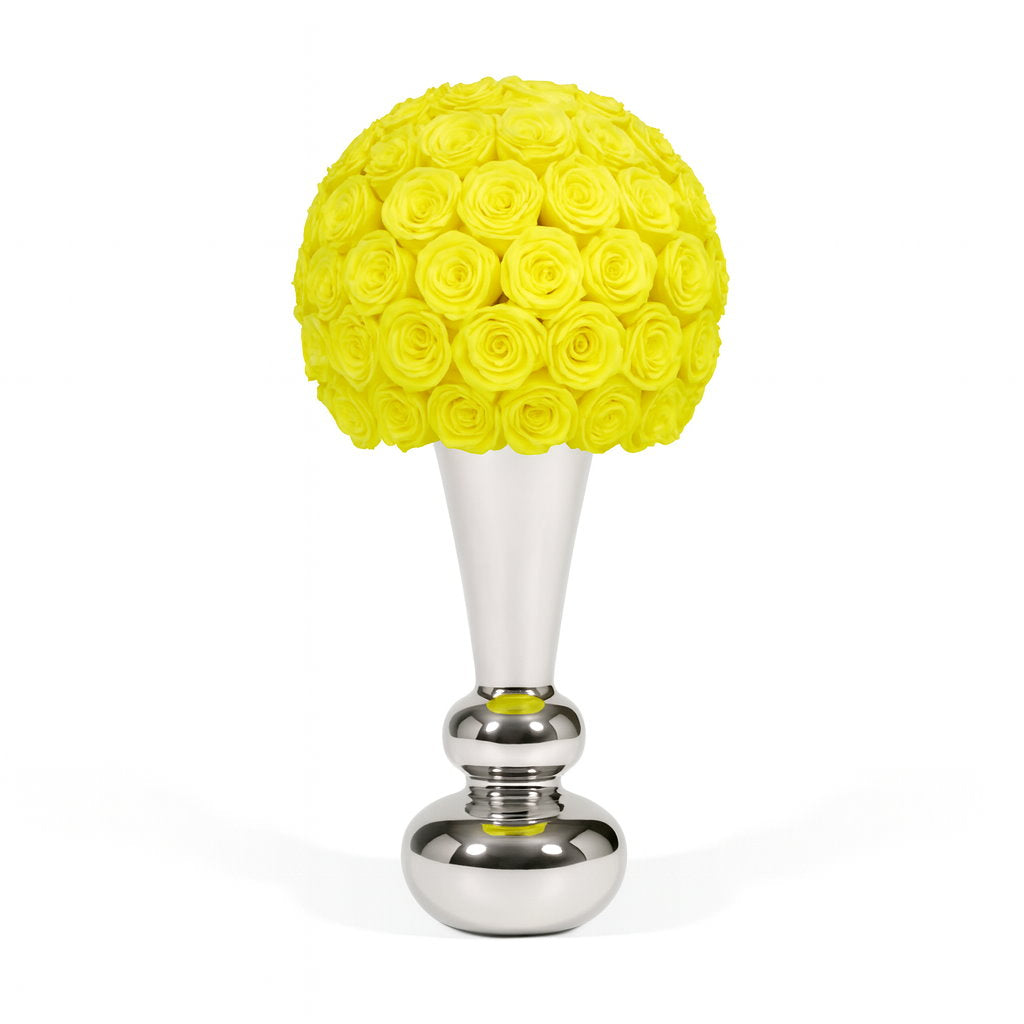 Yellow rose ball on a silver stand against a white background
