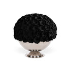 Black rose arrangement in a silver pedestal bowl on a white background
