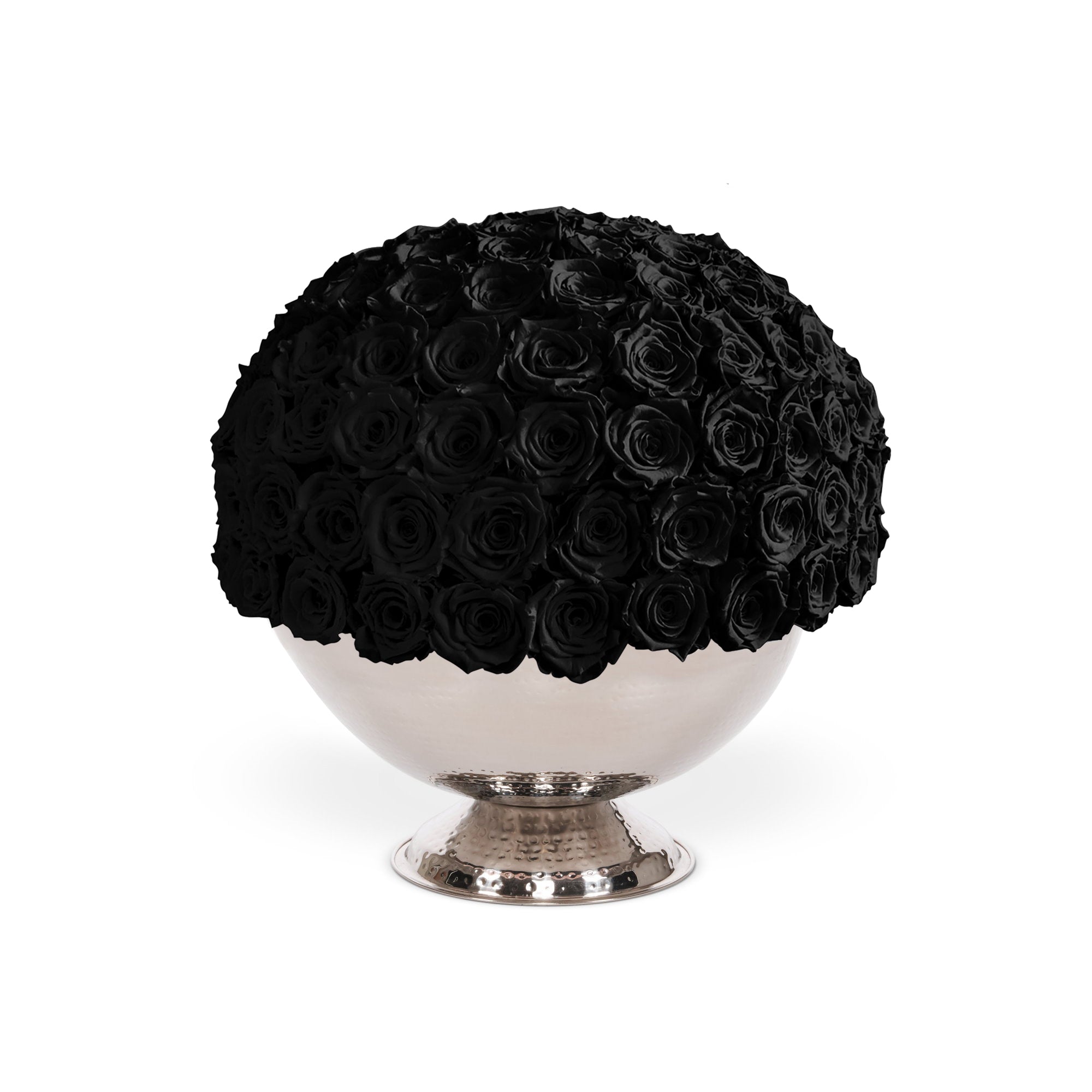 Black rose arrangement in a silver pedestal bowl on a white background
