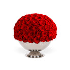Bouquet of red roses in a white vase on a white background