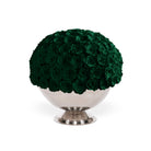 Spherical arrangement of green roses on a white pedestal against a white background