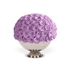 Decorative sphere made of purple roses on a white background