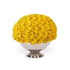 Bouquet of yellow roses in a white vase on a white background