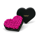 Heart-shaped box of pink roses with 'OnlyRoses' branding on a white background