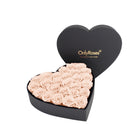 Heart-shaped box of pink roses with 'OnlyRoses' branding on a white background