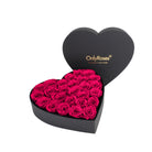 Heart-shaped box of pink roses with 'OnlyRoses' branding on a white background