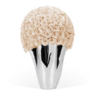 Silver vase with a large ball of beige roses on a white background