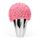 Silver vase with a large ball of Pink roses on a white background