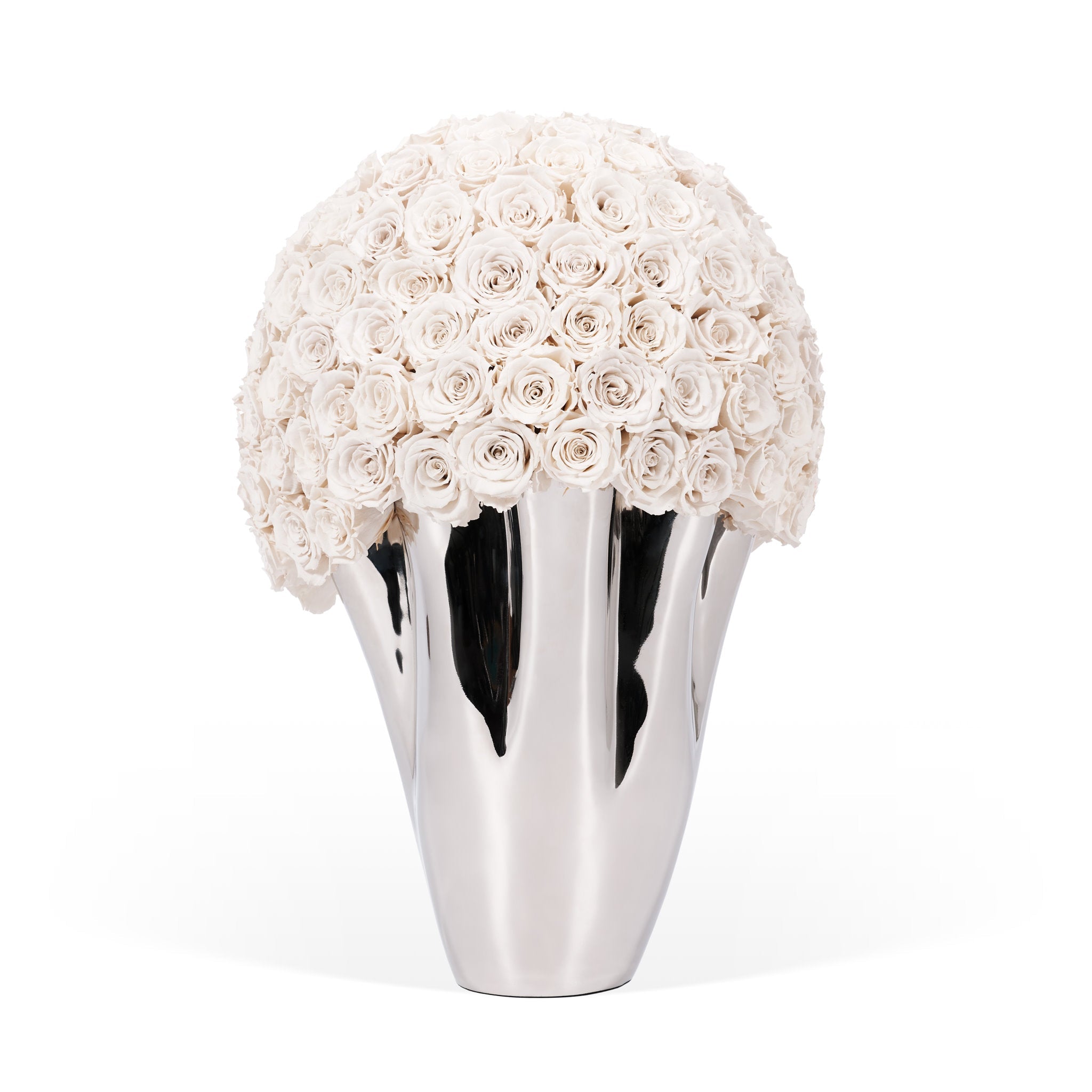 Silver vase with a spherical arrangement of white flowers on a white background