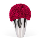 Silver vase with a large ball of red roses on a white background