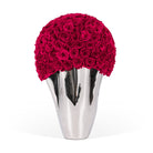 Silver vase with a large ball of red roses on a white background