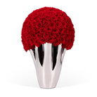 Silver vase with red roses on a white background