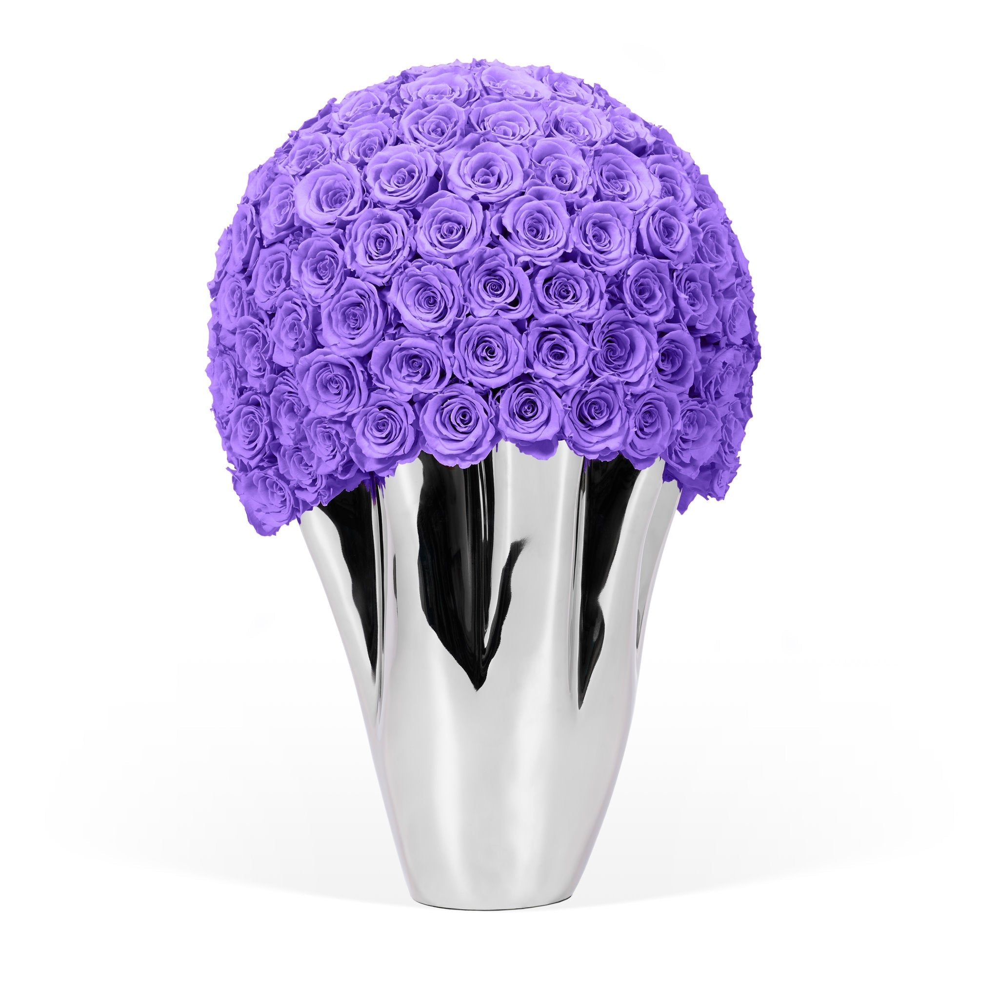 Silver vase with a large purple flower arrangement on a white background