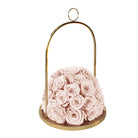 Gold hanging holder with pink roses on a white background