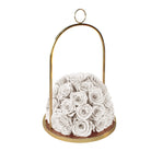 Decorative holder with white roses on a white background