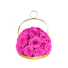 Pink roses in a gold metal basket on a white background