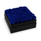 Black box filled with blue roses on a white background