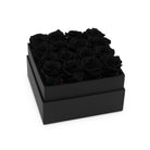 Black box with black roses on a white background