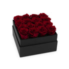 Black box with red roses on a white background