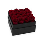 Black box with red roses on a white background