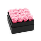 Black box with pink roses on a white background