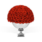Bouquet of red roses in a silver vase on a white background