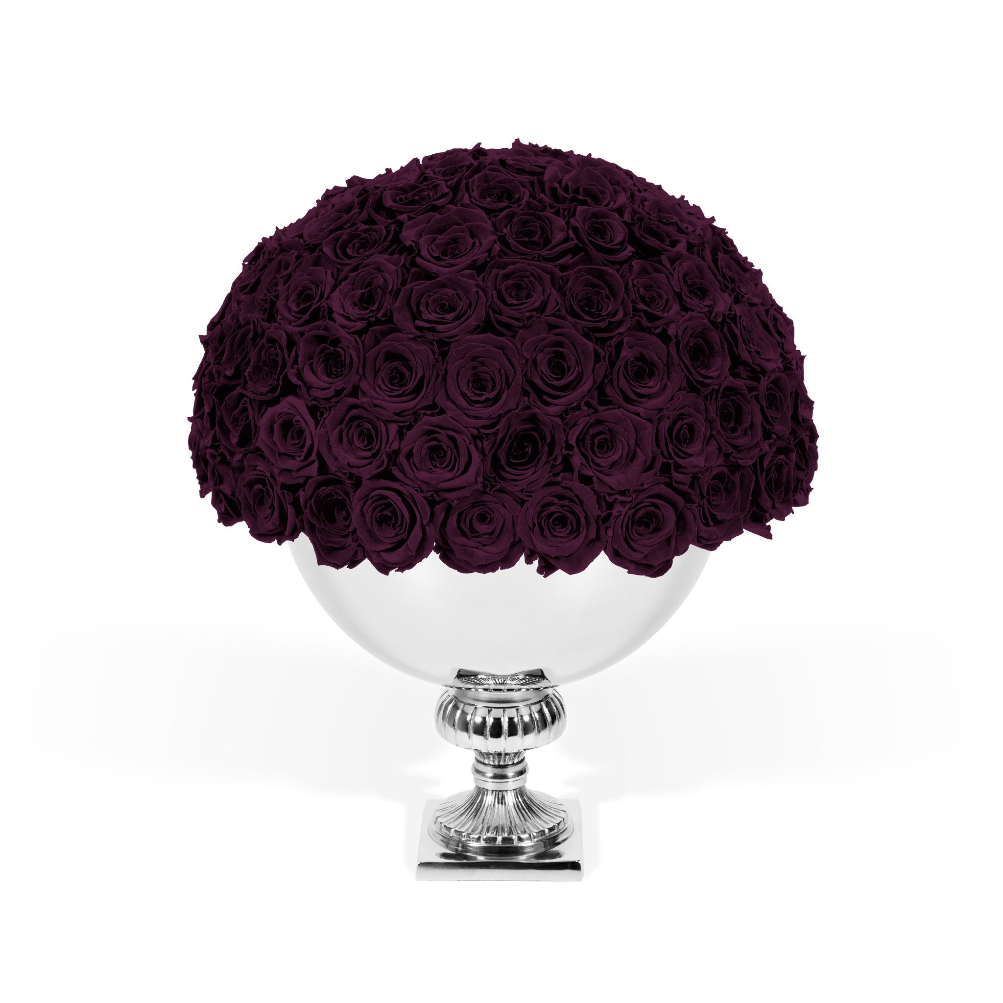 Bouquet of dark purple roses on a white pedestal against a white background
