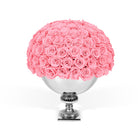 Bouquet of pink roses in a silver vase on a white background