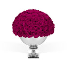 Bouquet of pink roses in a silver vase on a white background