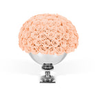 Bouquet of peach roses in a silver vase on a white background