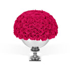 Bouquet of pink roses in a silver vase on a white background