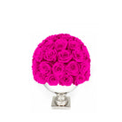 Bouquet of bright pink roses in a white vase on a white background