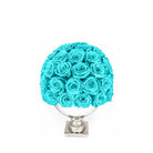 Turquoise roses in a white vase on a white background