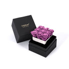 Black box with a white interior containing purple roses, branded 'Only Roses'.