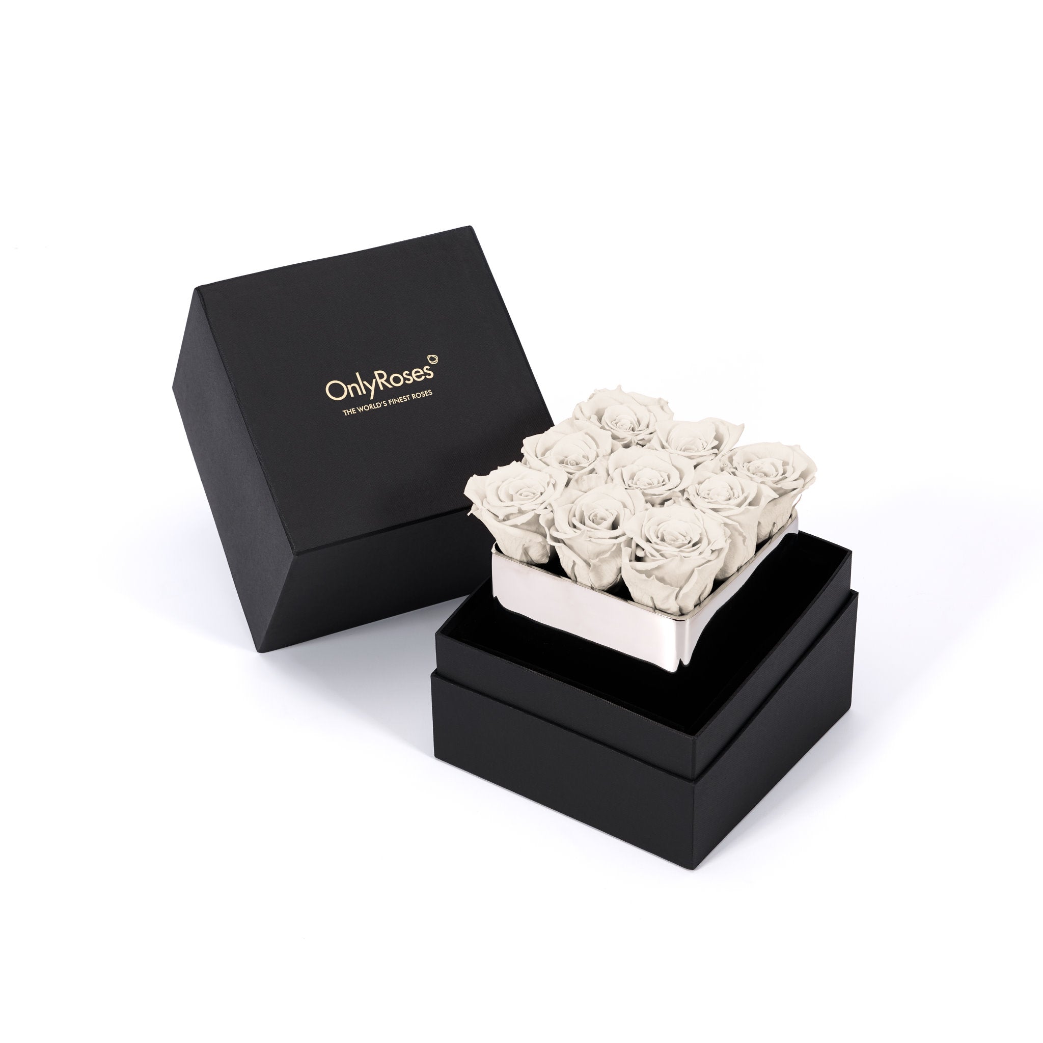 Black box with 'Only Roses' branding containing a small arrangement of white roses on a white background.